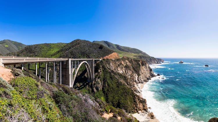 Pacific Coast Highway RV itinerary shown through an image of the bridge in Big Sur, Ca